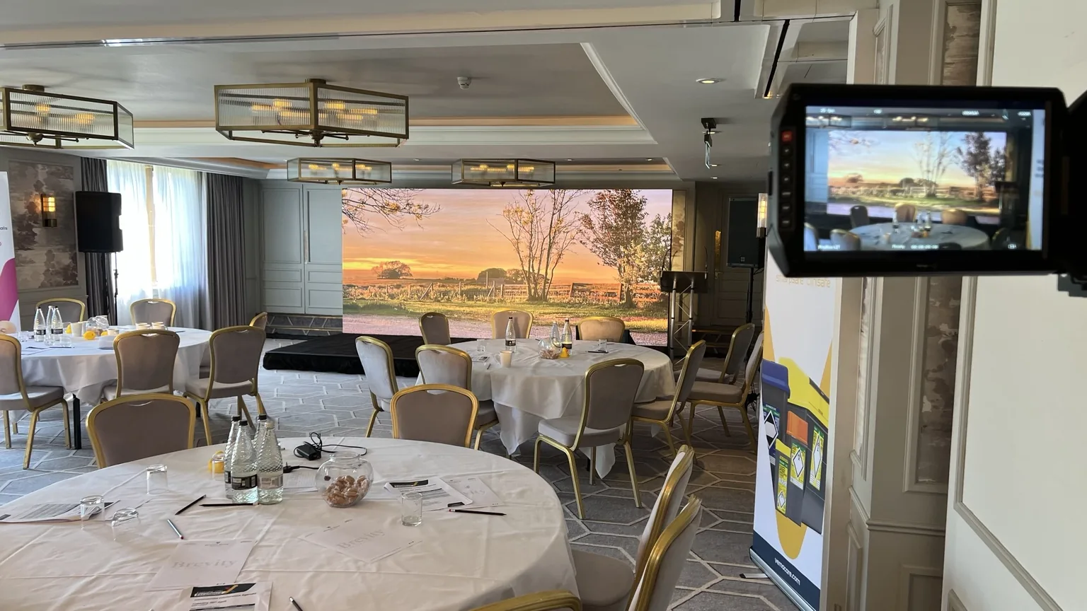 Corporate conference filmed in front of a large LED screen